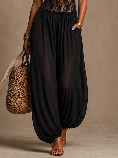 Elise™ | Flödande jumpsuit med halterneck och spets